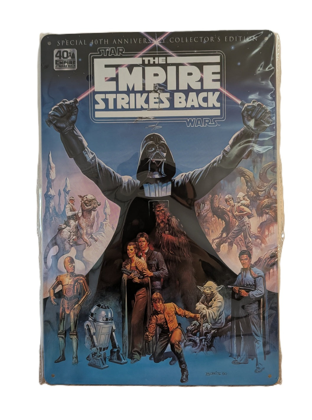 Vertical metal wall sign for Star Wars: The Empire Strikes Back 40th Anniversary, featuring Darth Vader with lightsabers and the main cast of heroes on a blue celestial background