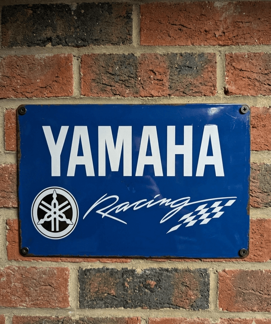 Yamaha Racing sign on a brick wall