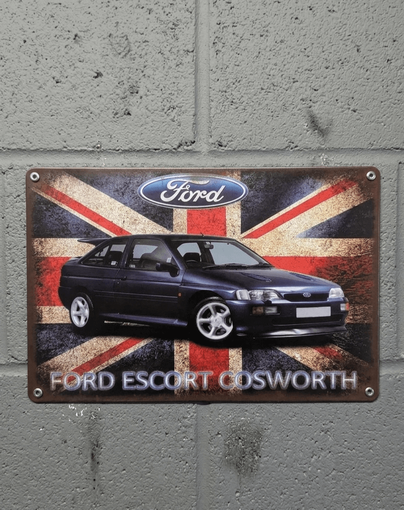 Vintage metal wall sign featuring a dark blue Ford Escort Cosworth on a distressed Union Jack flag background with the Ford logo