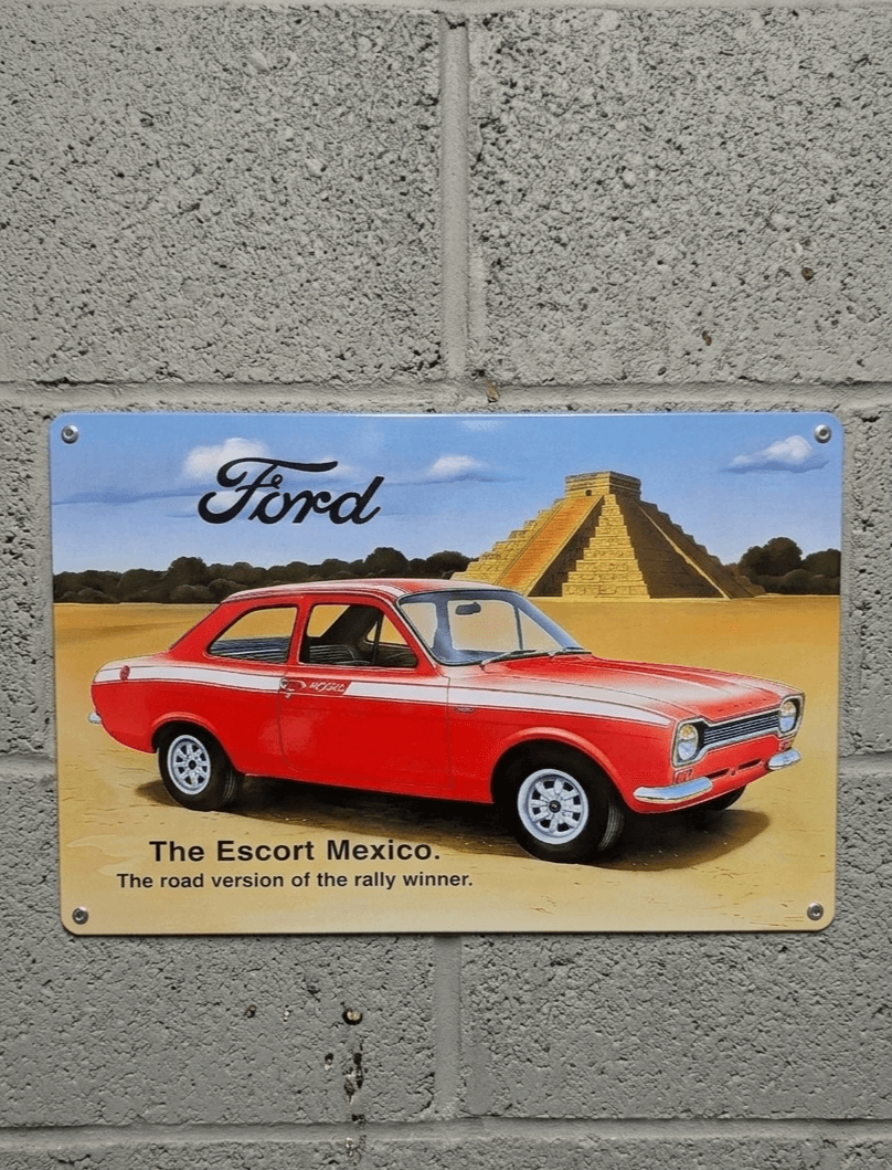 Vintage metal wall sign of a red Ford Escort Mexico with a pyramid background and the text The road version of the rally winner