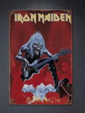 Vertical vintage-style metal wall sign for Iron Maiden, featuring mascot Eddie playing a bass guitar against a red smoky background with the text 'Fear of the Dark Live' and distressed rusted edges.