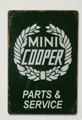 Vintage-style British Racing Green metal sign for Mini Cooper Parts & Service featuring a white laurel wreath logo and distressed rusted edges