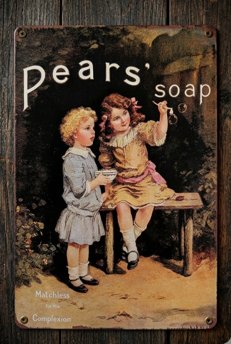 Vertical vintage-style metal wall sign for Pears’ Soap featuring an illustration of two young girls in Victorian attire blowing bubbles, with the slogan 'Matchless for the Complexion' on a distressed, aged background.