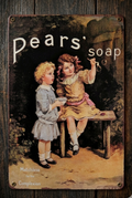 Vertical vintage-style metal wall sign for Pears’ Soap featuring an illustration of two young girls in Victorian attire blowing bubbles, with the slogan 'Matchless for the Complexion' on a distressed, aged background.