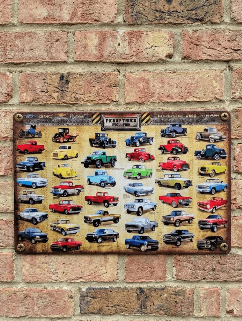 Vintage-style landscape metal wall sign titled 'Pickup Truck Evolution', featuring a comprehensive grid of various truck models from early 20th century to modern day with brand logos like Ford, GMC, Dodge, and Jeep.