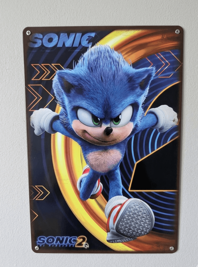 Vibrant metal wall sign featuring Sonic the Hedgehog from the Sonic 2 movie, with a high-action pose against a golden ring and blue background