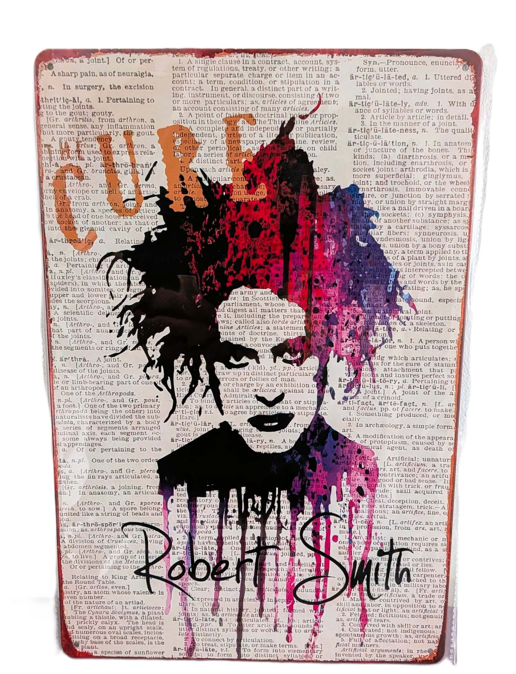 Vertical retro-style metal wall sign featuring a colorful splash watercolor portrait of Robert Smith from The Cure over a printed background of vintage dictionary text, complete with his signature script and distressed rusted edges.