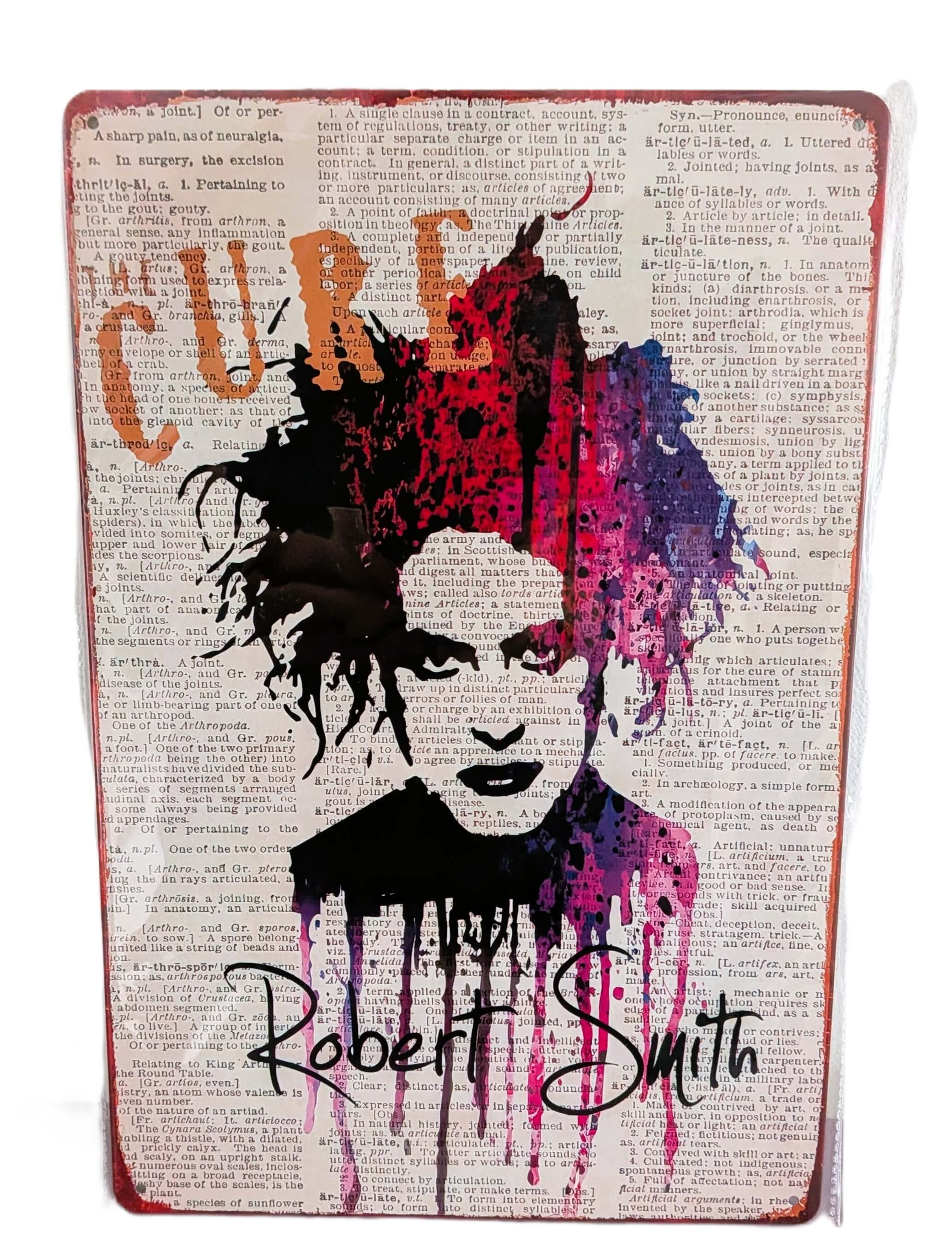 Vertical retro-style metal wall sign featuring a colorful splash watercolor portrait of Robert Smith from The Cure over a printed background of vintage dictionary text, complete with his signature script and distressed rusted edges.