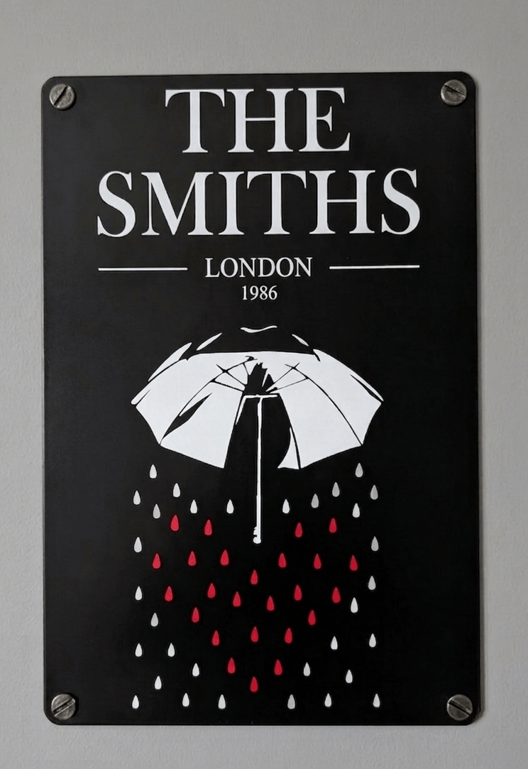 Vertical black metal wall sign for The Smiths featuring the band name and 'LONDON 1986' in white serif font above a graphic of a white umbrella shielding red and white raindrops.