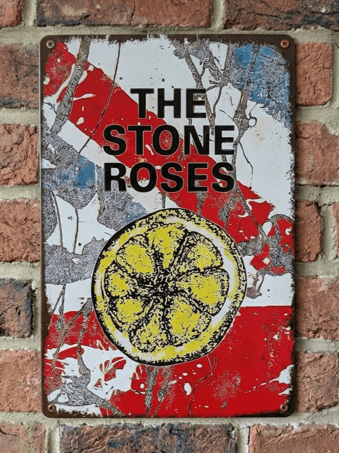 Vintage-style vertical metal wall sign for the band The Stone Roses, featuring their iconic lemon logo over a red and white paint-splattered background with heavily rusted, distressed edges