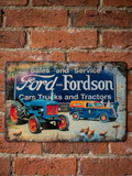 Vintage-style landscape metal wall sign for Ford and Fordson Sales and Service, featuring a blue tractor and an orange and blue farm service van with rural farmyard details and rusted edges.