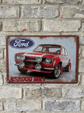 Vintage-style landscape metal wall sign for the Ford RS2000 MK1, featuring a red performance car with distinctive quad-lamps and the Ford oval logo on a distressed grey background with rusted edges.