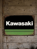 Vintage-style landscape metal wall sign featuring the Kawasaki logo in white over a black and lime green background with a heavily distressed, rusted border