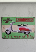 Vintage-style green and white metal wall sign for Lambretta scooters, featuring a classic silver and red scooter with the slogan It's a way of life and a distressed, rusted border