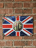 Vintage-style landscape metal wall sign featuring the MG octagonal logo centered over a distressed Union Jack flag with heavily rusted edges