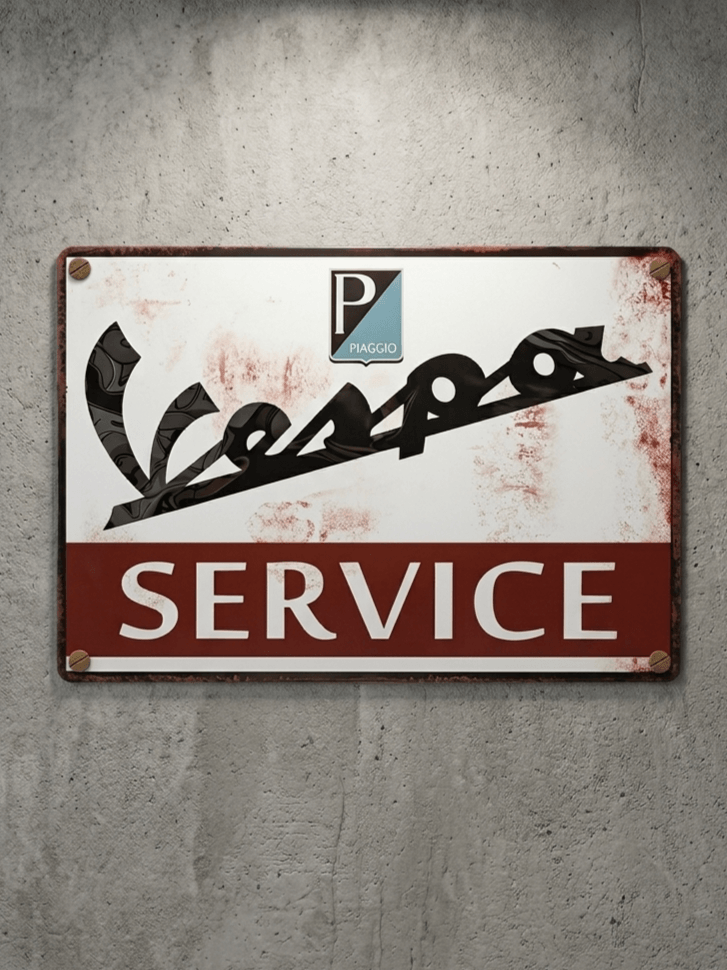 Horizontal vintage-style metal wall sign for Vespa Service, featuring the stylized black Vespa script and Piaggio shield logo on a white top half, with 'SERVICE' in white block text on a red bottom bar, mounted on a concrete wall with rusted edges.