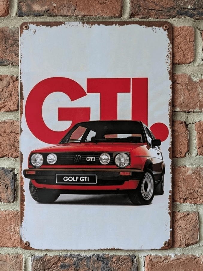 Vintage-style vertical metal wall sign for the Volkswagen Golf GTI featuring a red Mk2 model in front of large red GTI lettering with heavily rusted, distressed edges